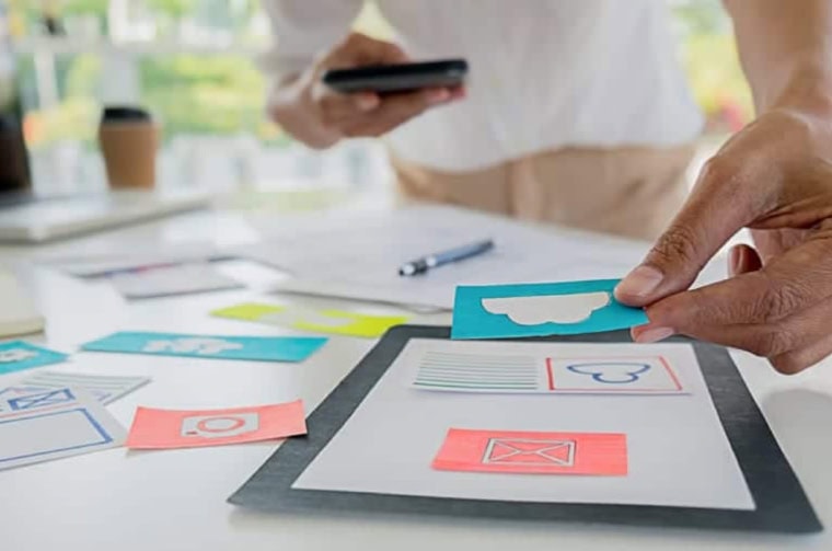 photo of someone making paper based wireframes