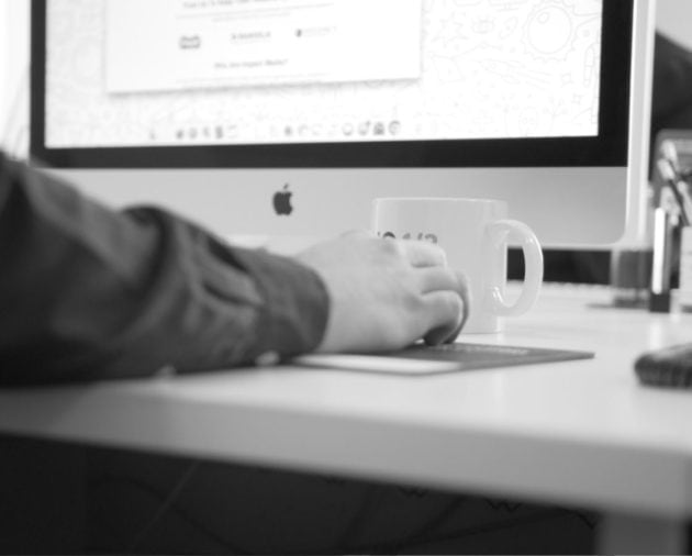 image of impact media team member at computer