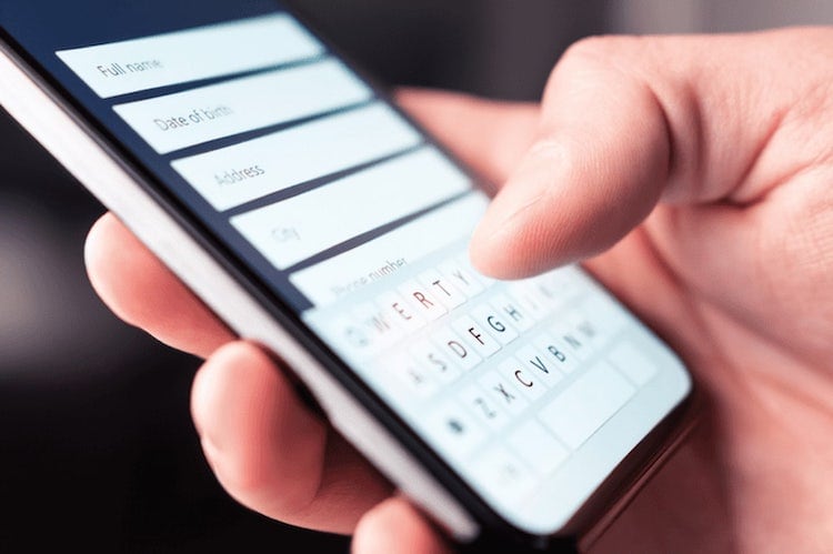 Photo of someone completing a form on a mobile phone