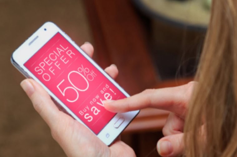 woman looking at a pop-up on a mobile phone