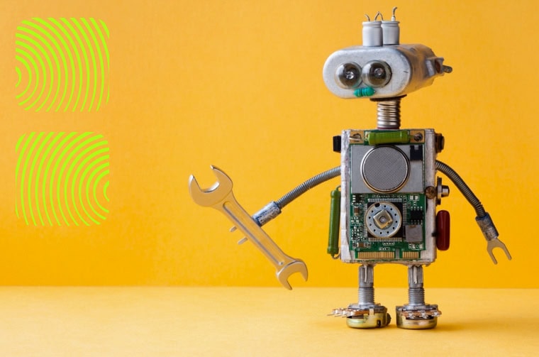 robot holding a spanner