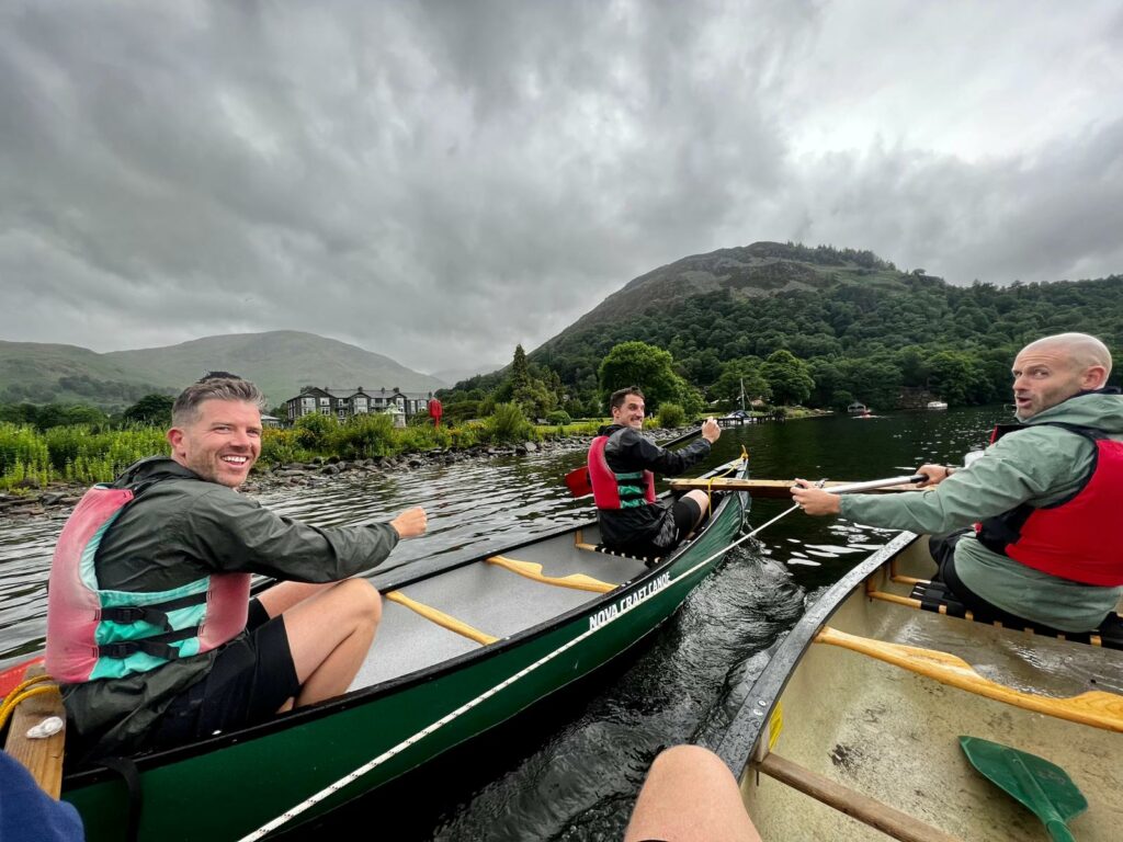 Pedal, Paddle, Peak challenge team in canoes