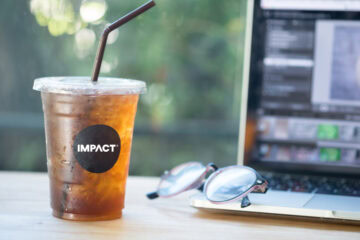 ice cold drink melting in front of laptop