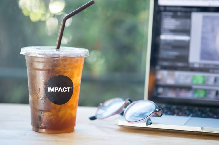 ice cold drink melting in front of laptop