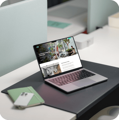 the AIS Interiors website on a laptop at a desk